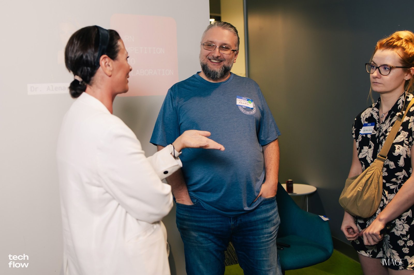 Dr.D speaking with people at Tech Flow